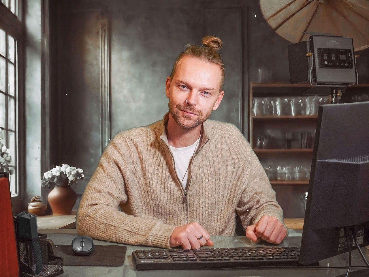 Production coordinator working at a computer