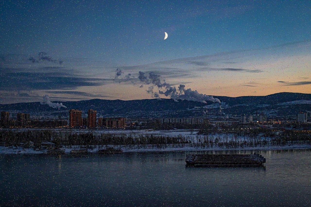 Industrial harbour and skyline at dusk