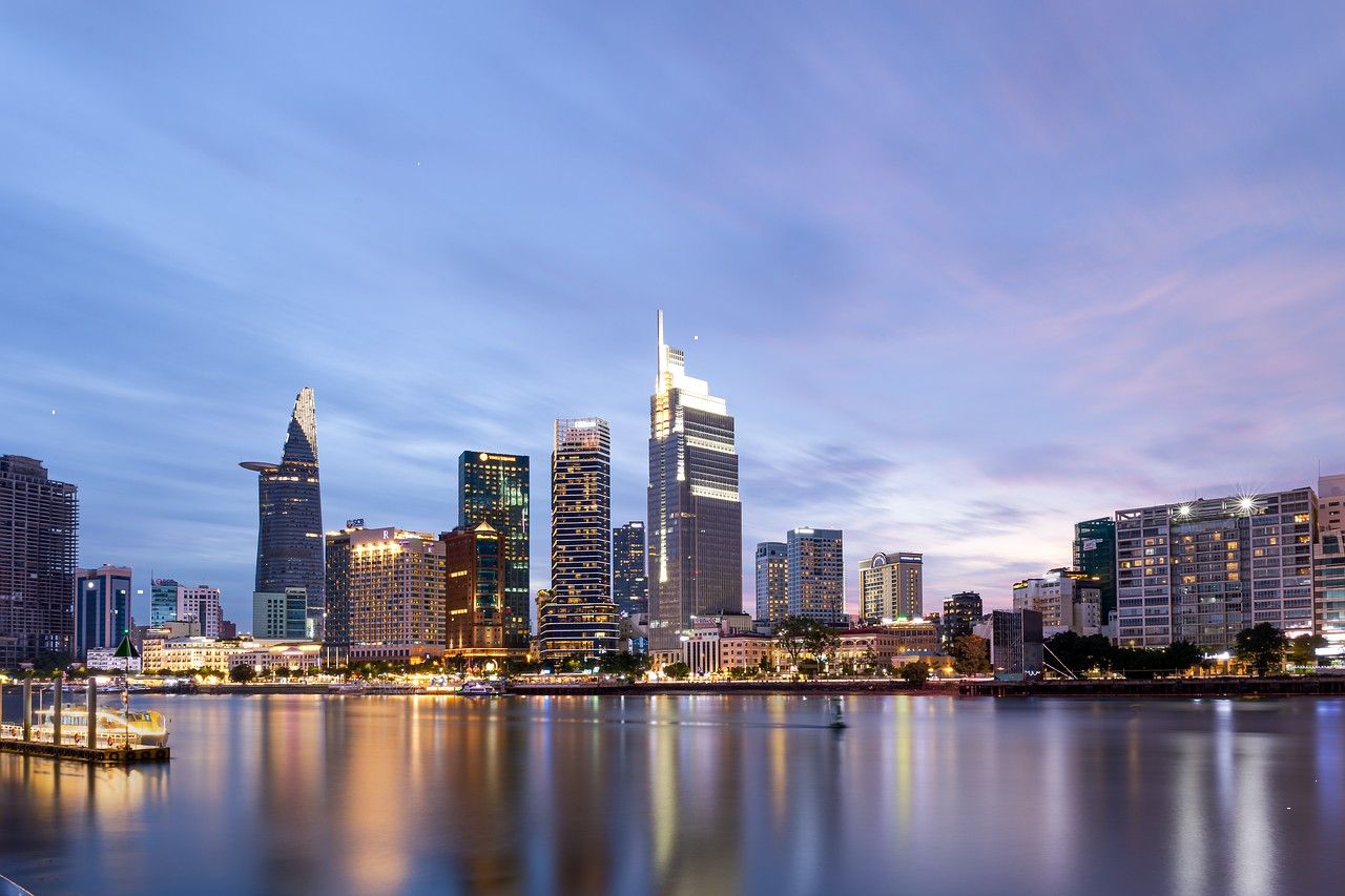 Glass tower skyline on a waterfront at dusk